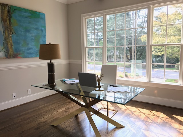 Staged office with large windows